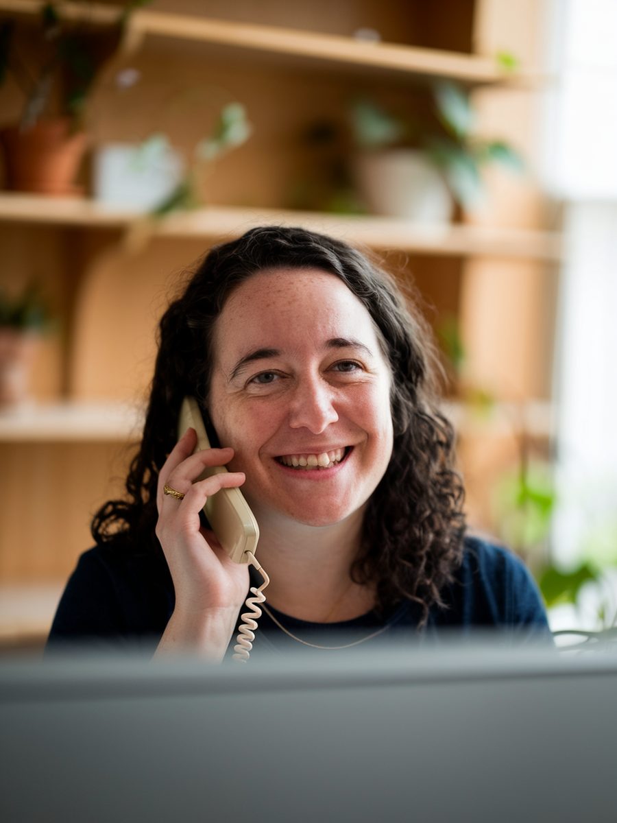 A friendly member of the AdBeacon team taking a call